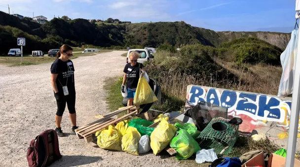 volunteers at a beach cleanup initiative.