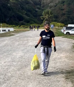 volunteer at a beach cleanup initiative.